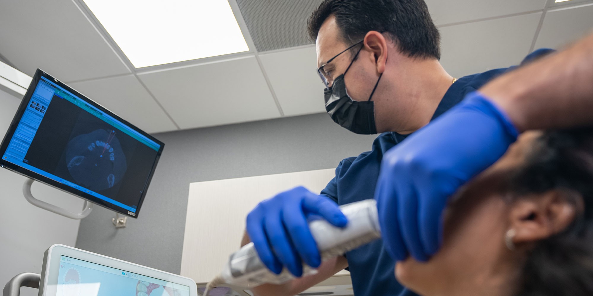 doctor treating a patient in a dental office