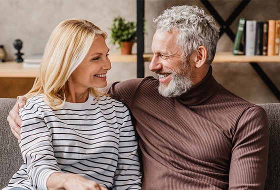 happy couple sitting and smiling