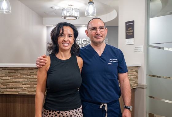 doctor standing with a patient