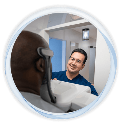 dr anatoly shaking hands with a patient in dental office
